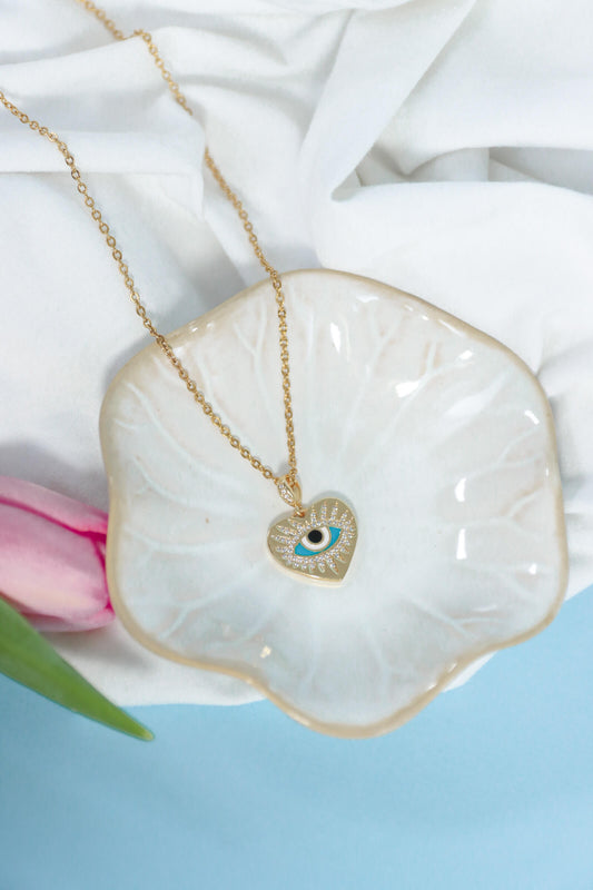 Collier doré avec pendentif coeur et oeil porte-bonheur turquoise